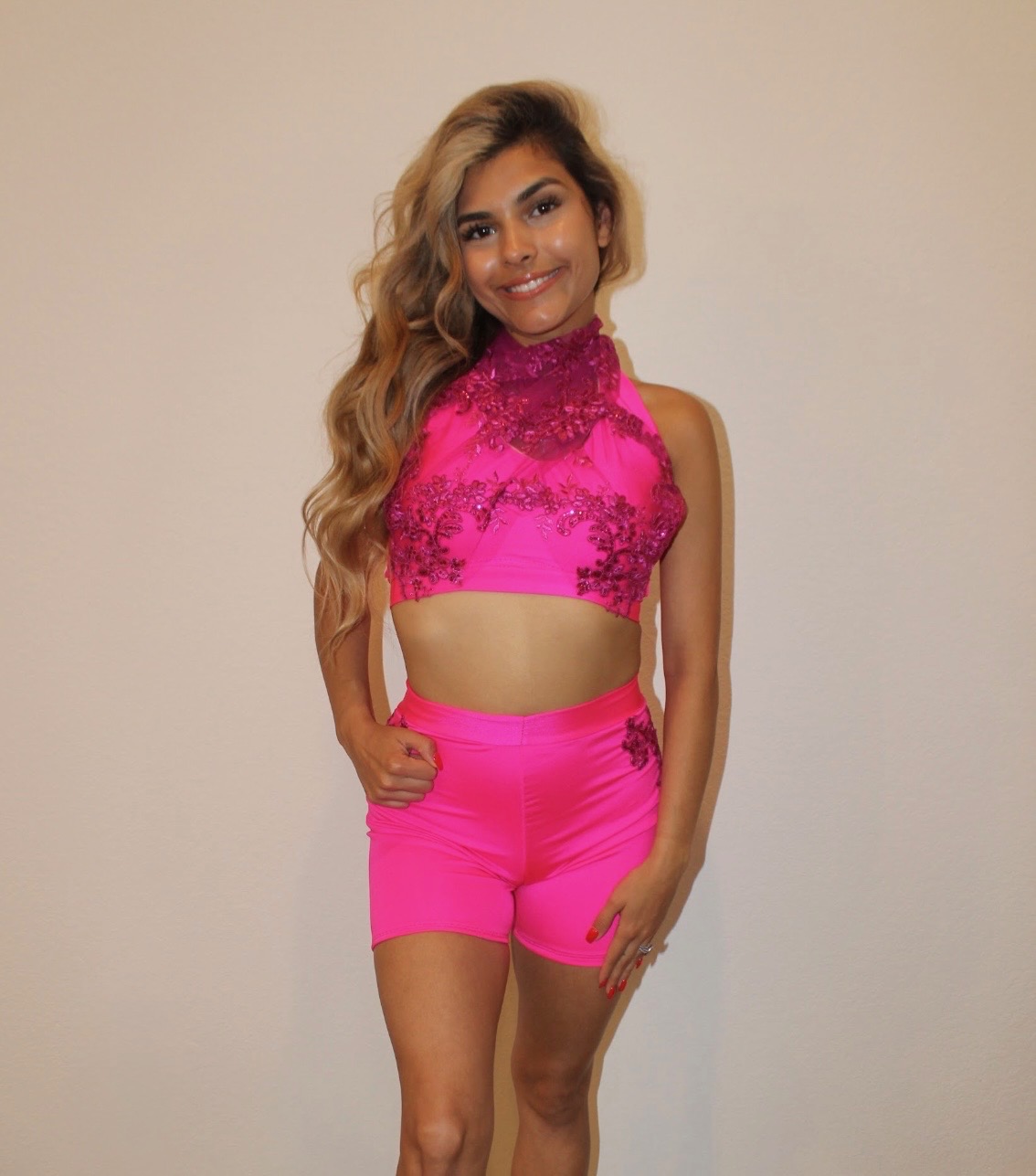 Close detail of appliqué placement on high-waisted shorts