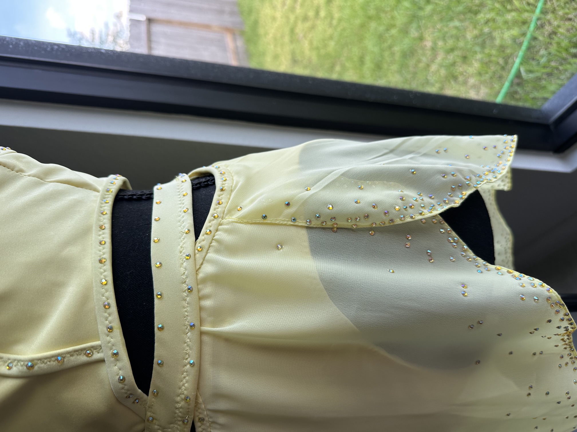 Close detail of hand-set rhinestones on the bodice